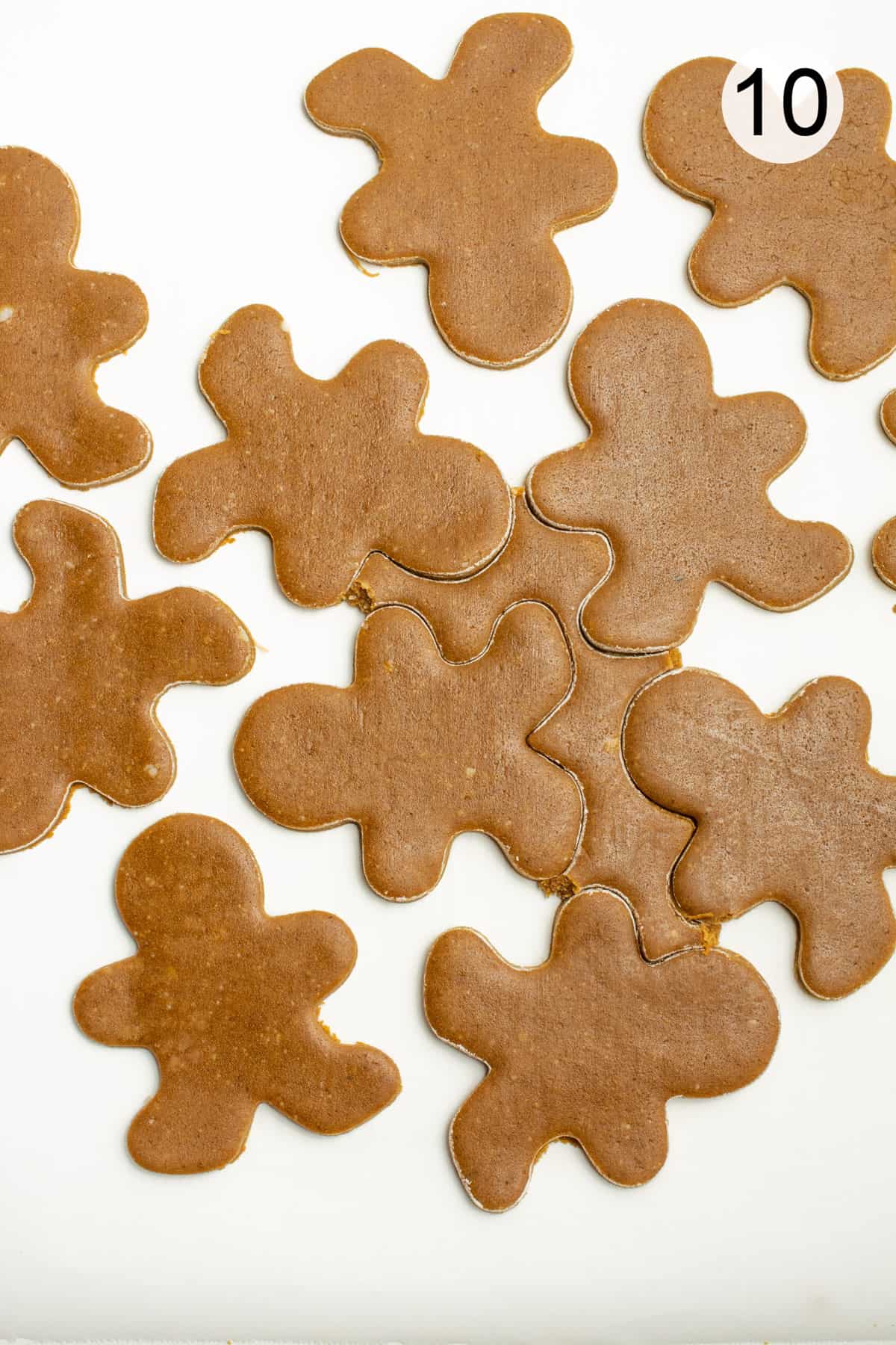 Gingerbread cookie dough cut out.