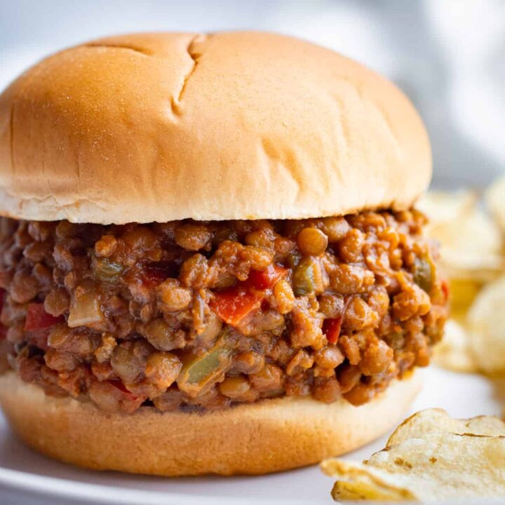 Lentil and tofu sloppy joe on a white bun.