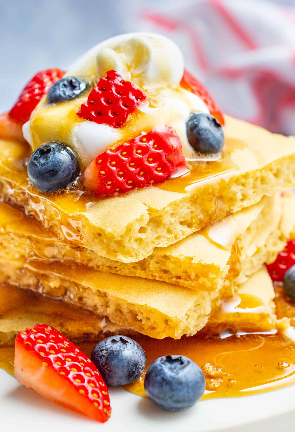 Sheet pan pancakes covered in maple syrup.