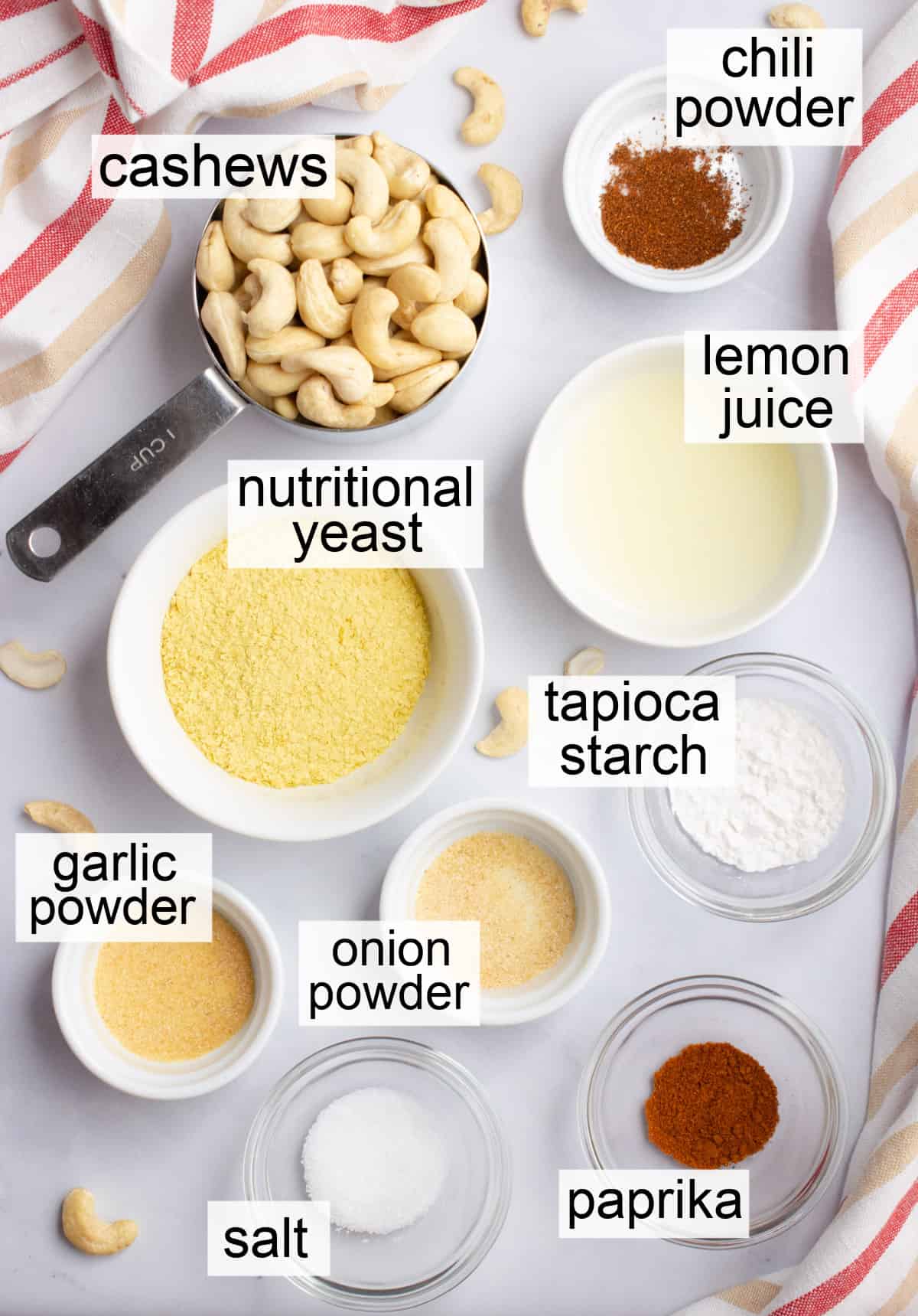 Small bowls of ingredients needed to make vegan nacho cheese sauce.