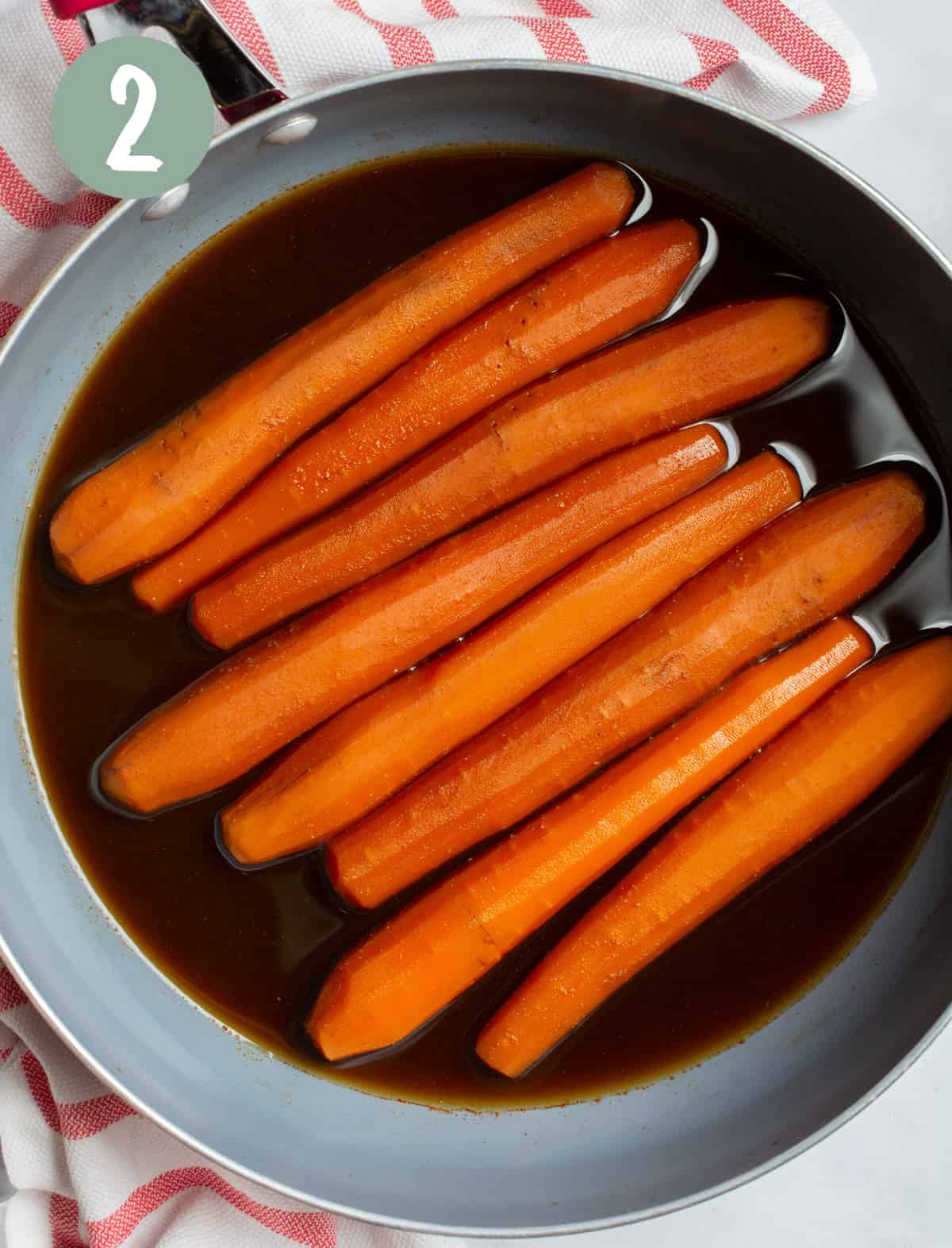 Carrots in a pan cooked in marinade.