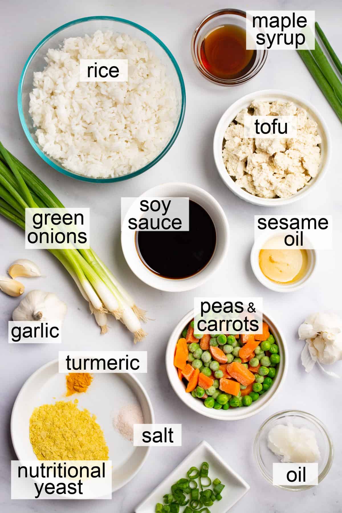 Bowls filled with ingredients to make vegan fried rice.