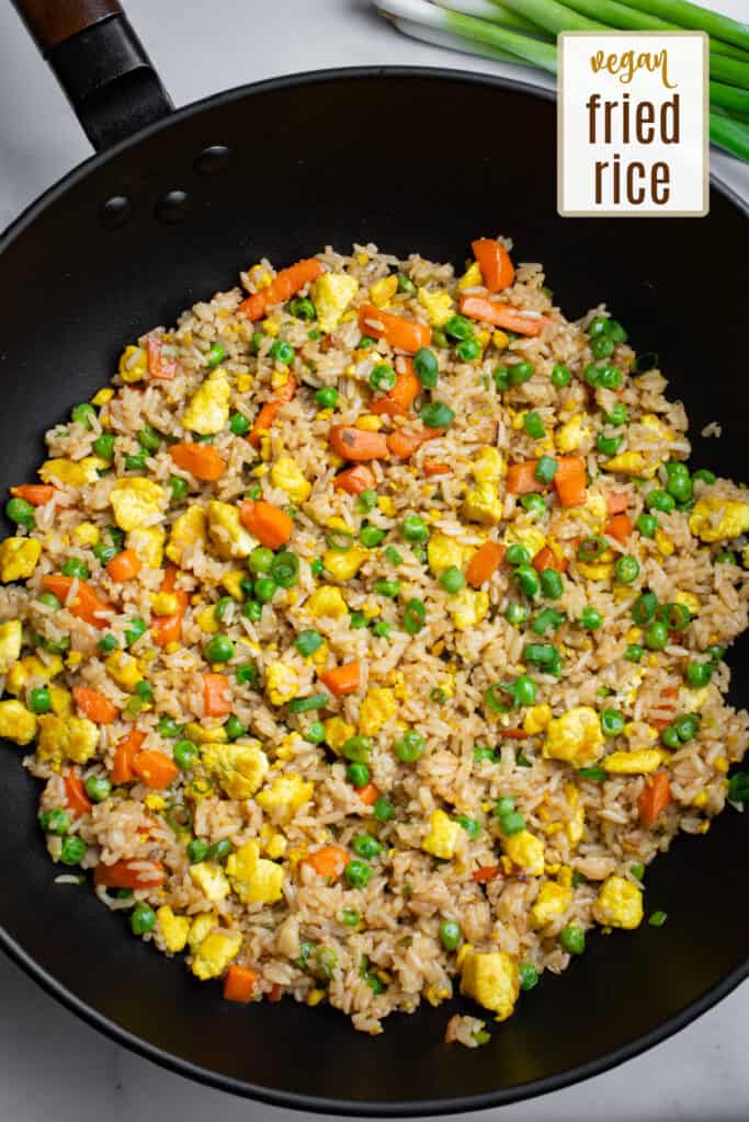 Cooked tofu fried rice in a wok.
