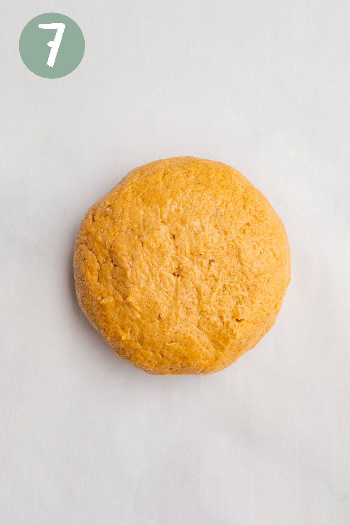 A ball of vegan pumpkin scones dough.