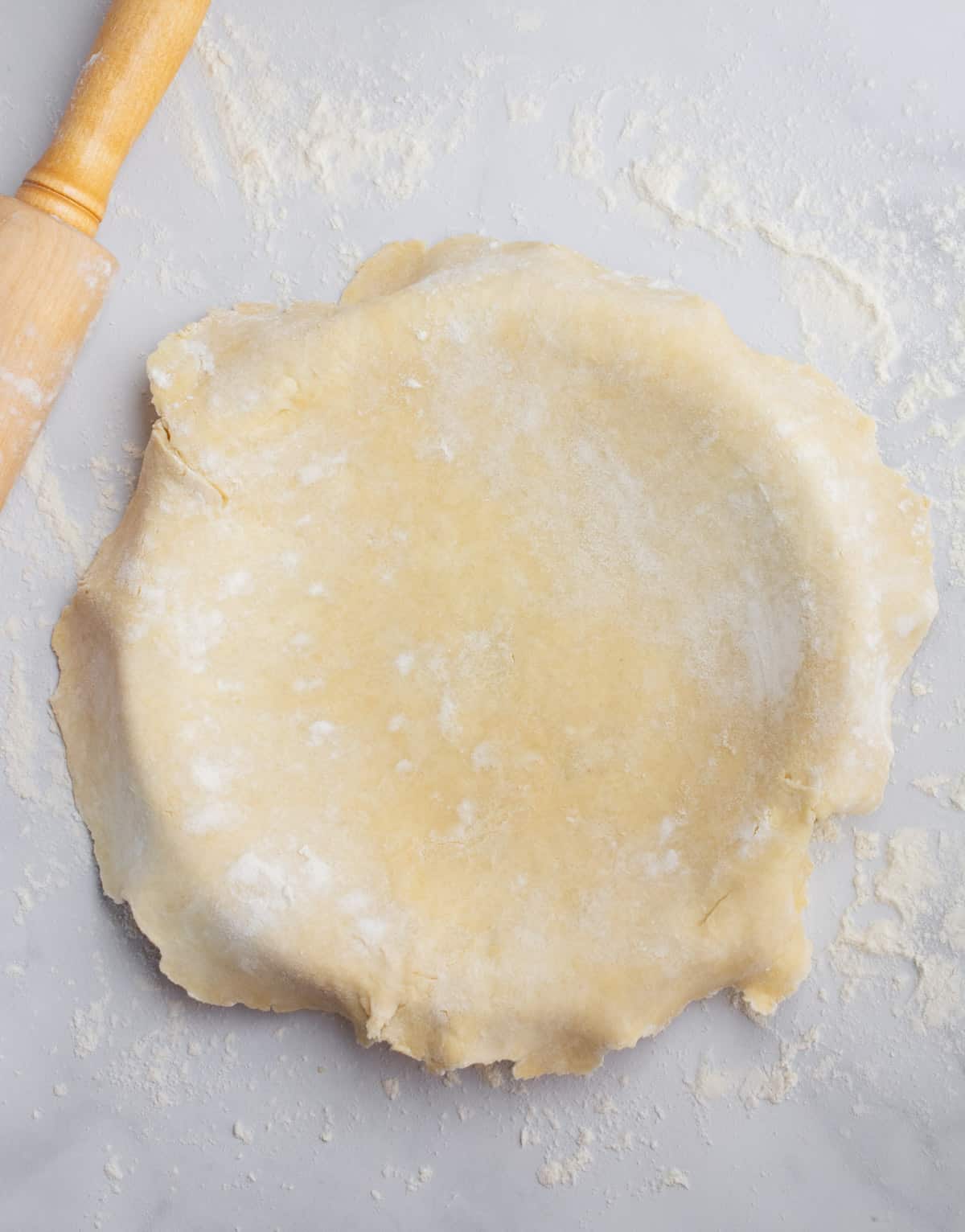 Vegan pie dough covering a pie dish.