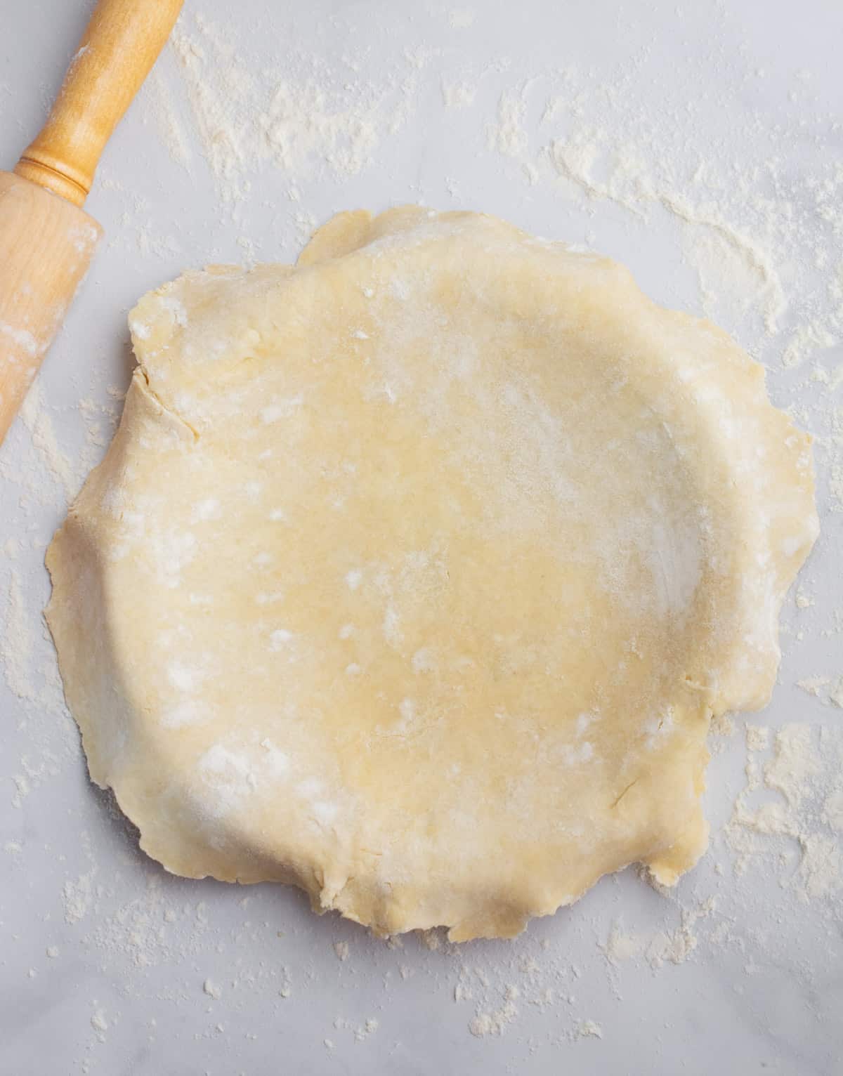 Vegan pie dough covering a pie dish.