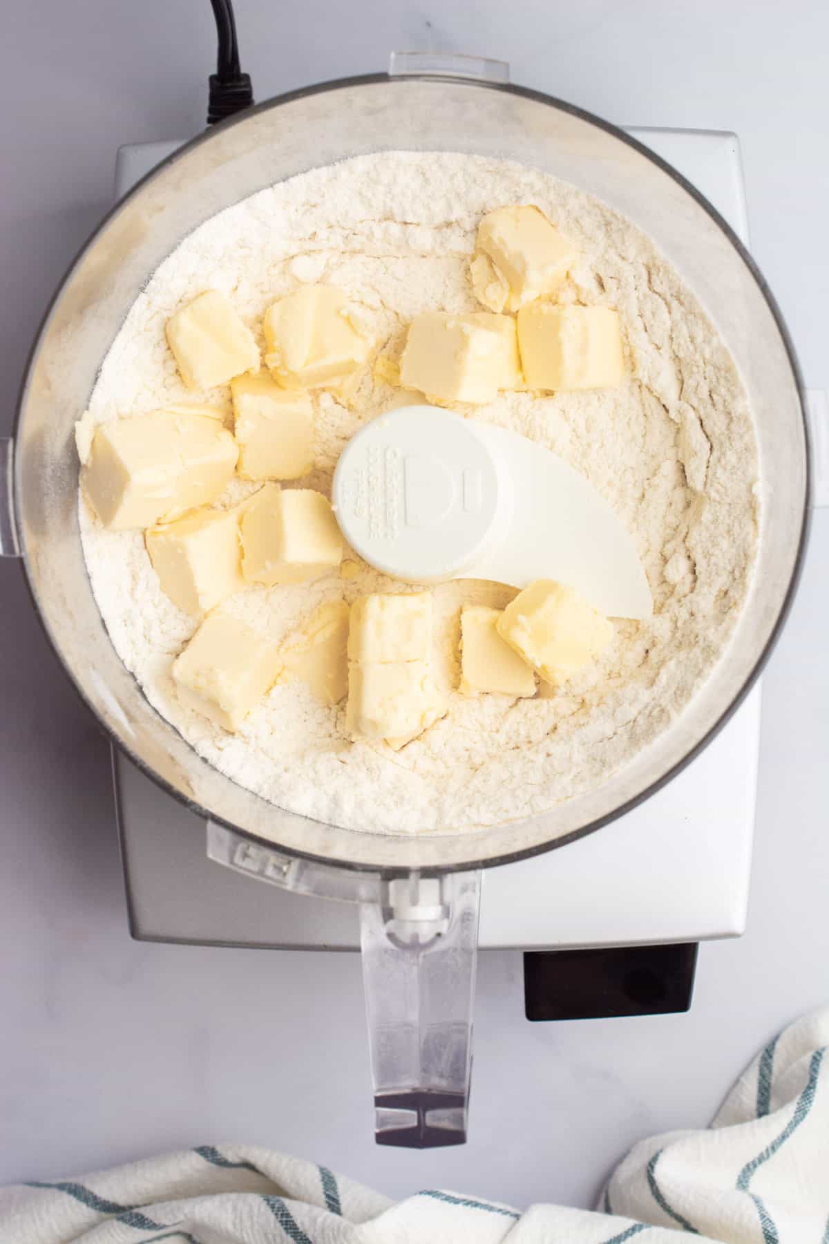 Flour, salt, and butter in a food processor.