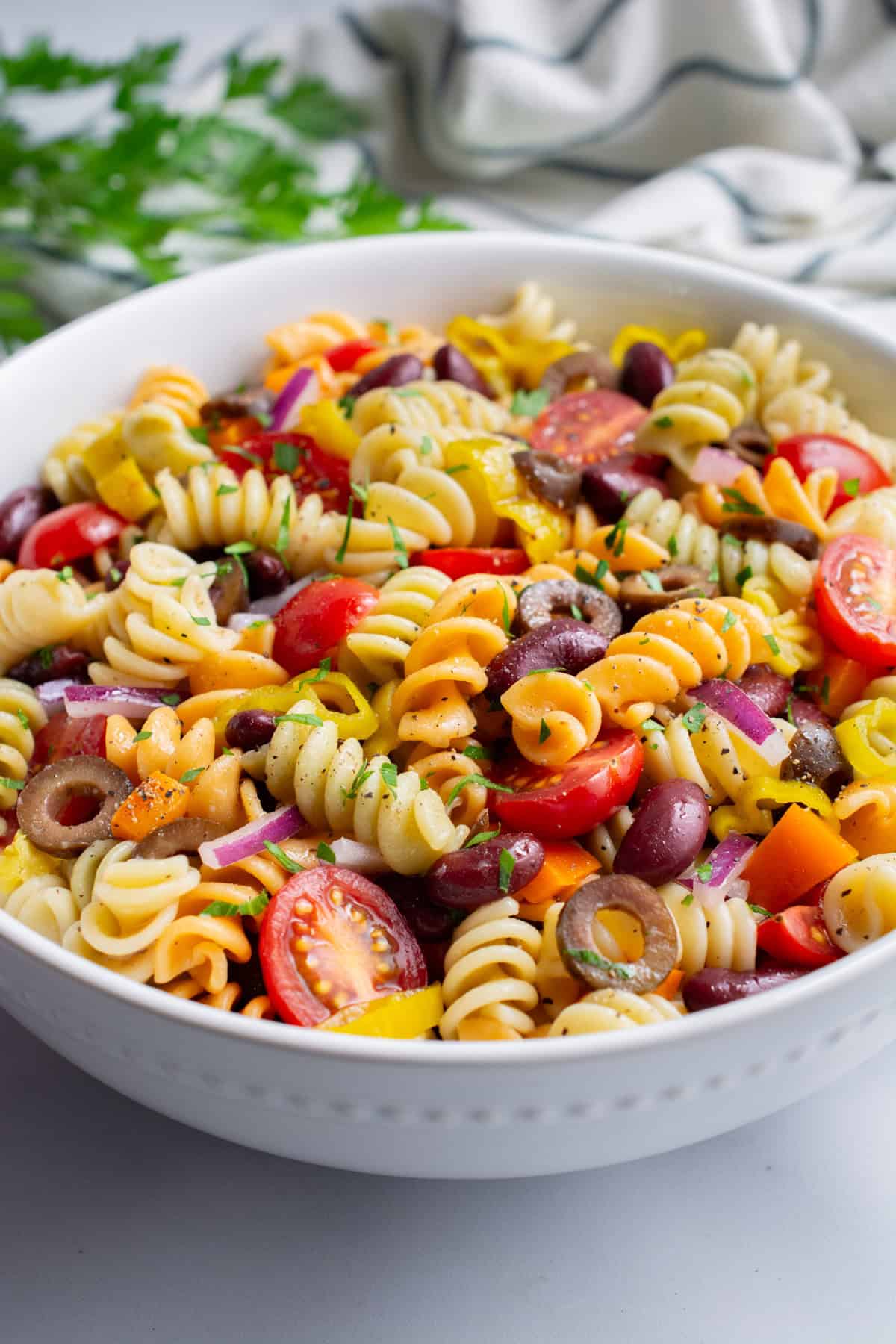 Vegan pasta salad in a white bowl.