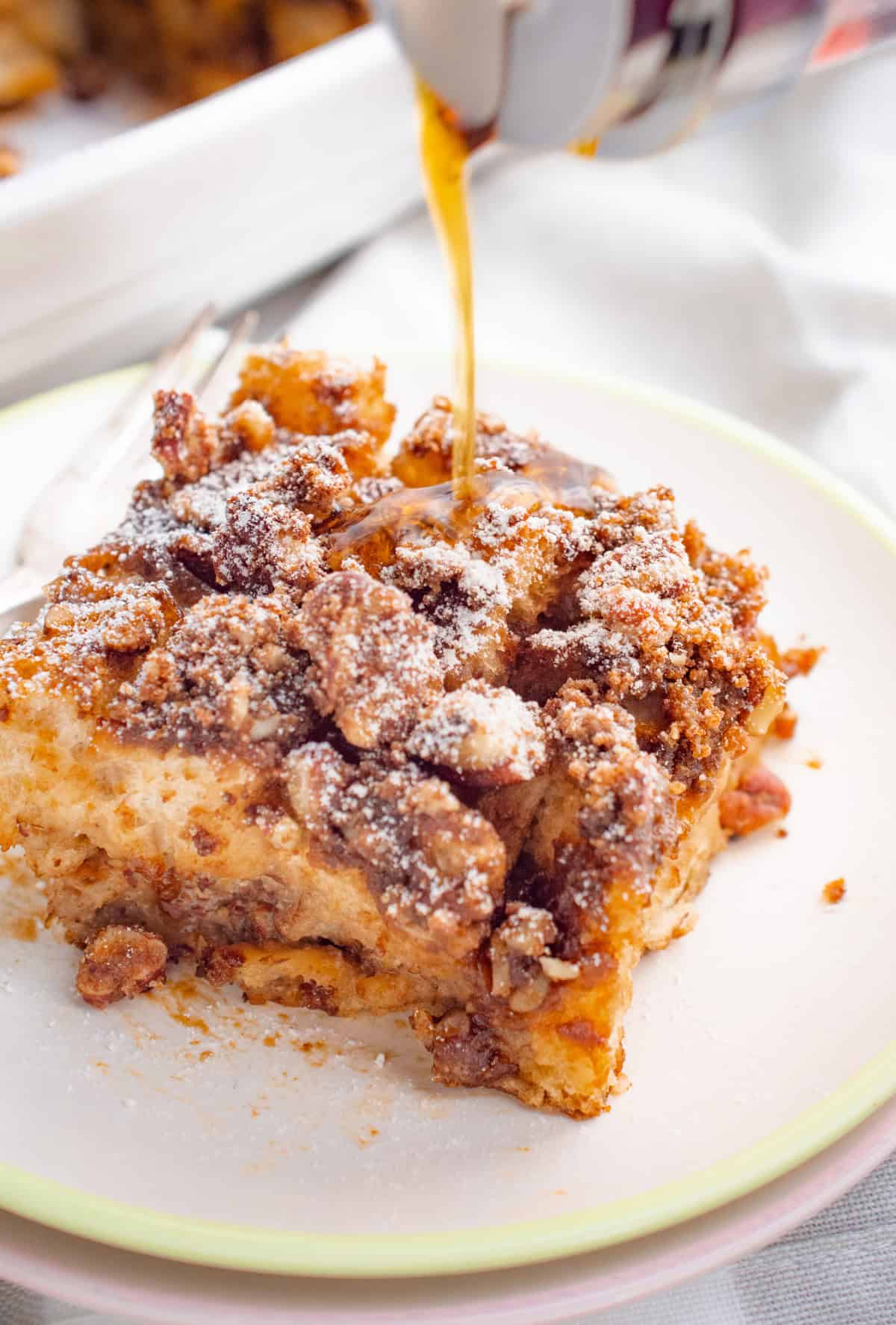 Syrup poured on french toast casserole.