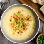 Cauliflower leek soup topped with green onions and coconut bacon.