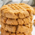 Three vegan peanut butter cookies stacked.