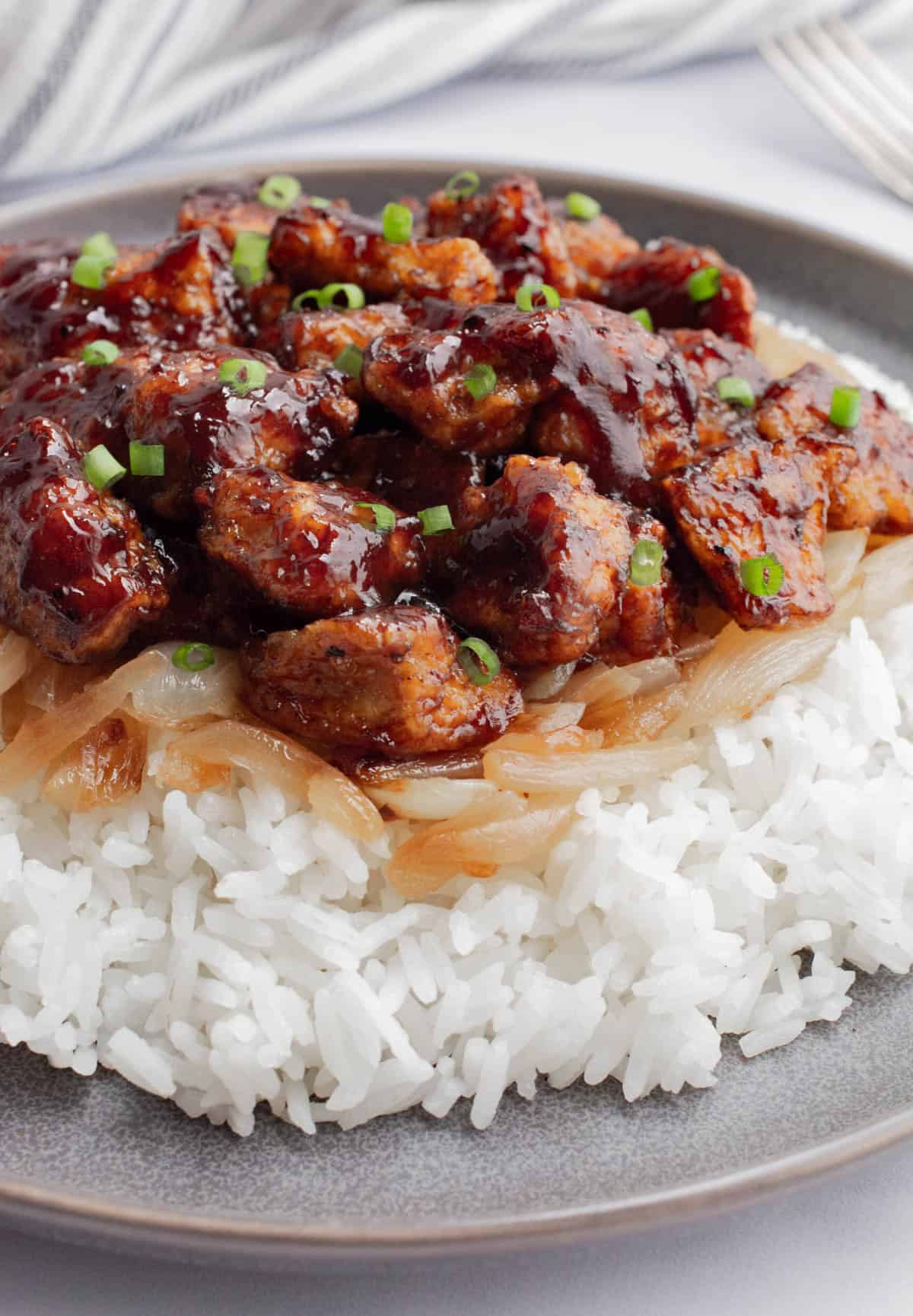Baked BBQ tofu on jasmine rice and caramelized onions.
