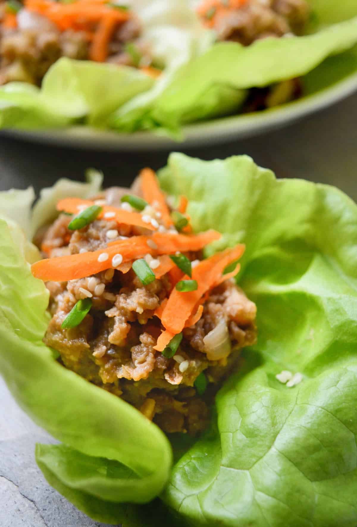 A butter lettuce leaf filled with a lentil mixture.