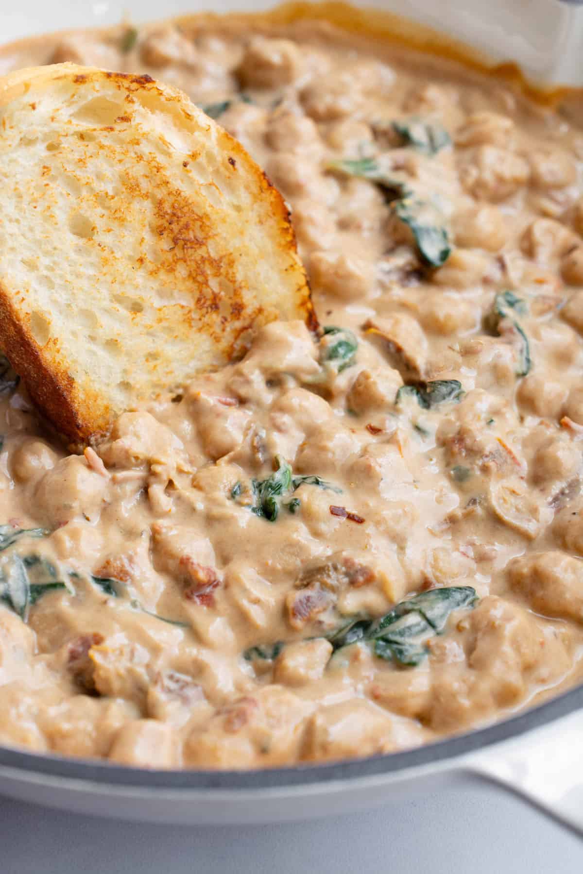 A pan of chickpeas in Tuscan sauce.