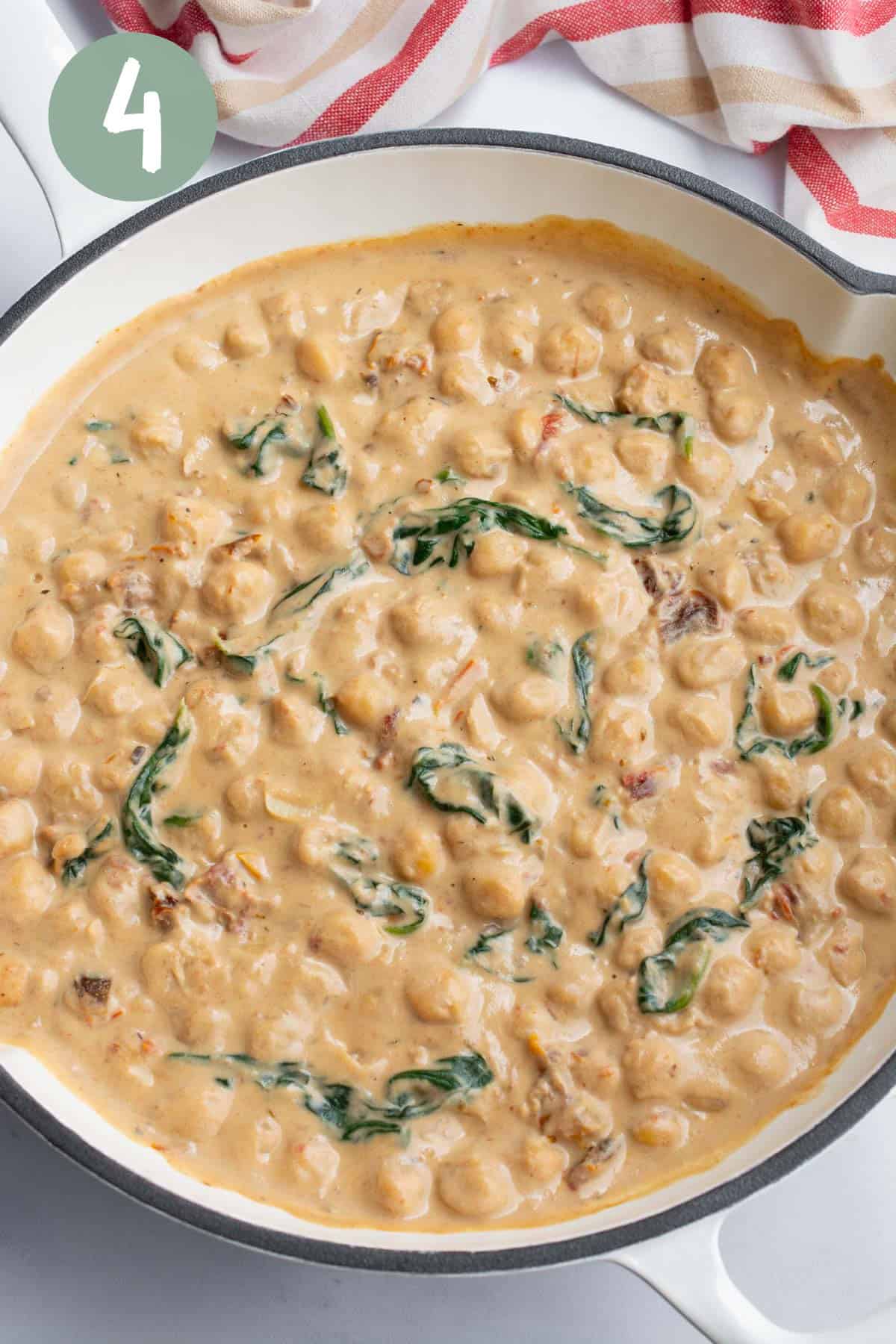 Chickpeas in a creamy sauce with spinach and sun-dried tomatoes.