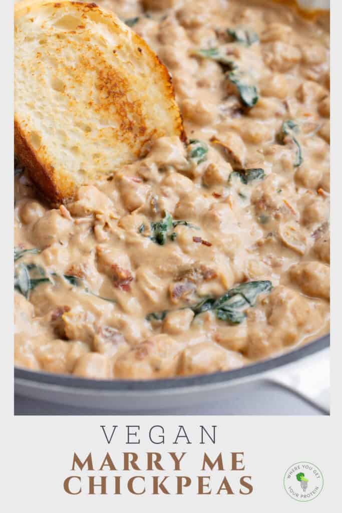 One-pan chickpeas in a skillet with a slice of toasted bread.