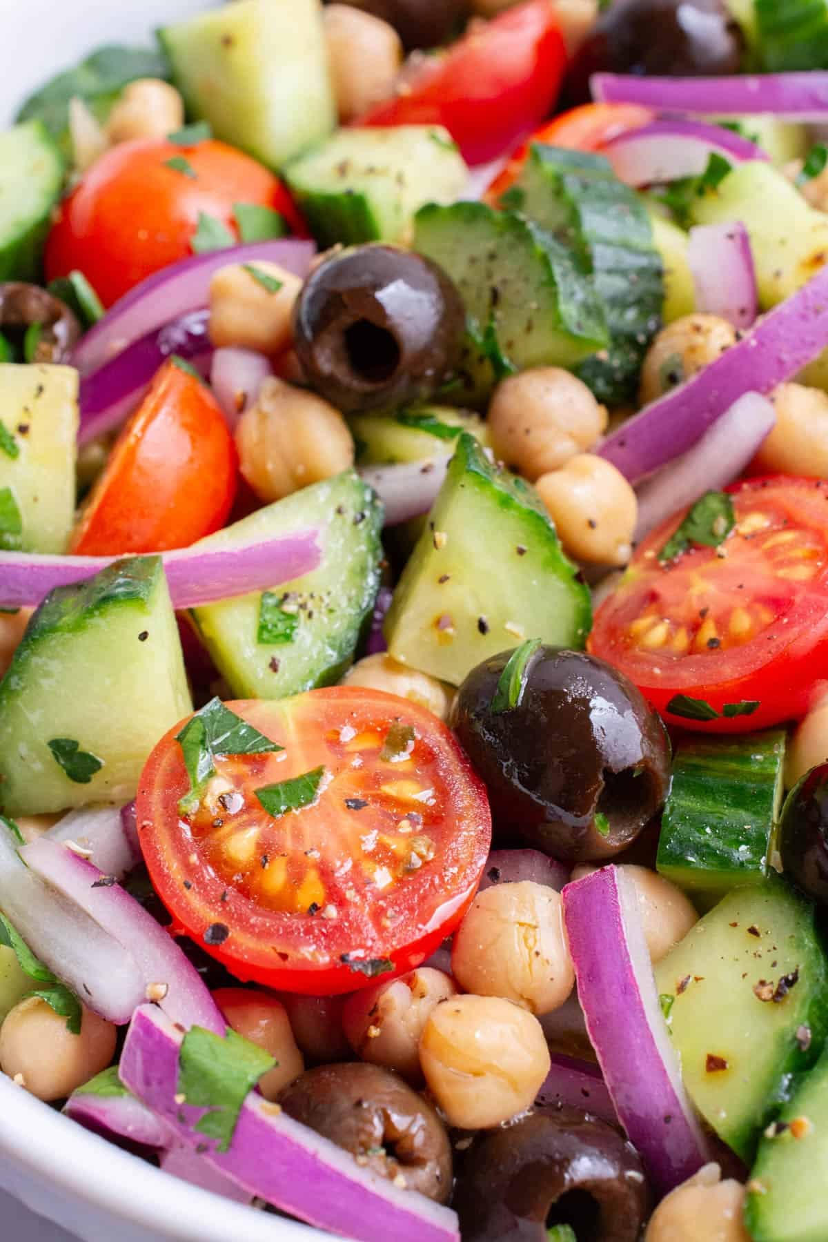 Close-up of chopped veggies in a glass bowl.
